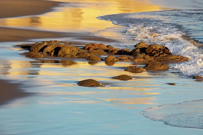 Framed Print : USA, California, Monterey. First light on with rocks at surf line reflection of blue and gold just off of the Coast Guard Pier in Monterey Bay Framed Print : USA, California, Monterey. First light on with rocks at surf line reflection of blue and gold just off of the Coast Guard Pier in Monterey Bay