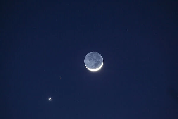 USA, California. The moon, Venus, and Pluto in the night sky