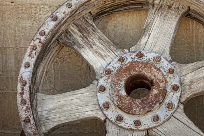 Framed Print : USA, California, Randsburg. Old wooden and metal wheel