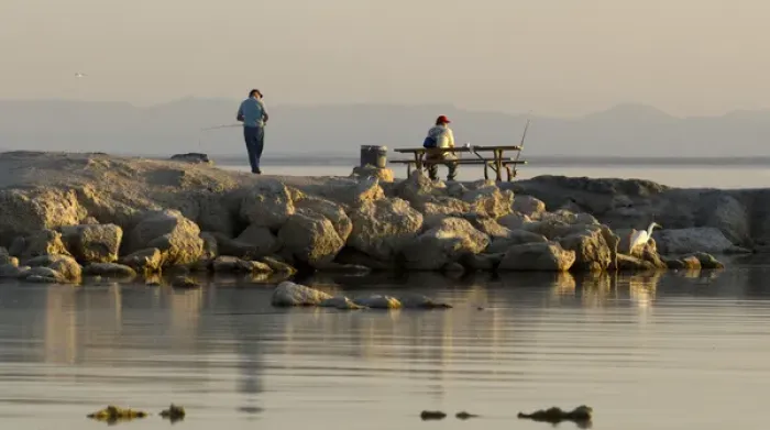 Framed Print : USA, California, Salton Sea. Men fishing at sunset in Salton Sea Framed Print : USA, California, Salton Sea. Men fishing at sunset in Salton Sea