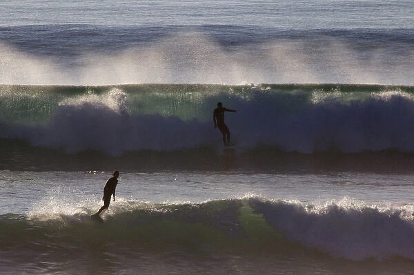 USA, California, San Diego. Surfers on waves at Cardiff by the Sea