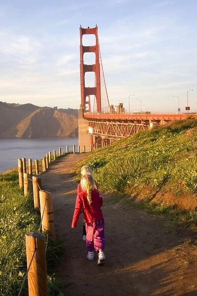 USA, California, San Francisco. Children walking on trail to the Golden Gate bridge. (MR)