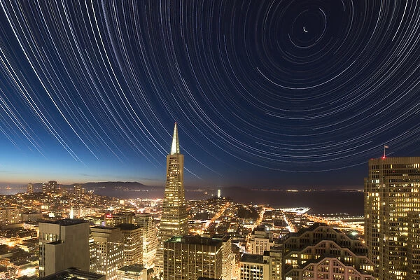 USA, California, San Francisco. Composite of star trails above Transamerica Building