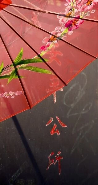 USA, California, San Francisco. Detailed image of red Chinese umbrella and painted