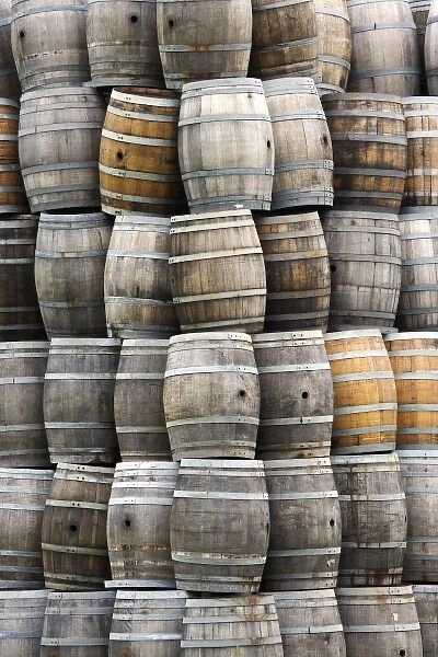 USA, California, San Luis Obispo County. Stacks of wine barrels