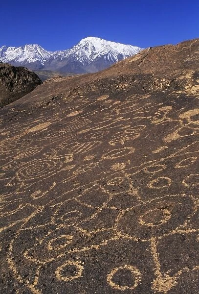USA, California, Sierra Nevada Range. View of circular and linear petroglyphs at