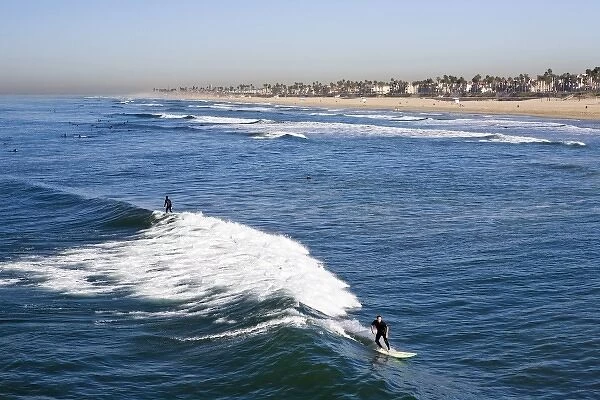 USA, California. Sunny summer views from atop the Huntington Beach Pier. Some of