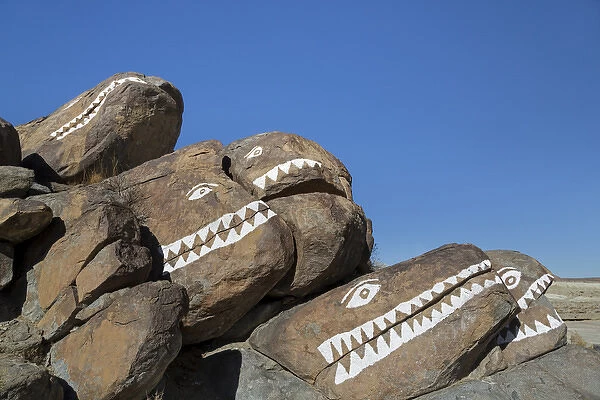USA, California, Trona Pinnacles. Rocks painted with crocodile faces