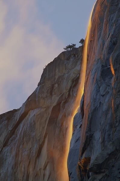 USA, California, Yosemite NP. Light reflects off Horsetail Falls, formed by melting