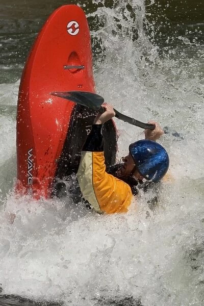 USA, Colorado, Arkansas River, Salida. Kayaker playboating in a river playpark