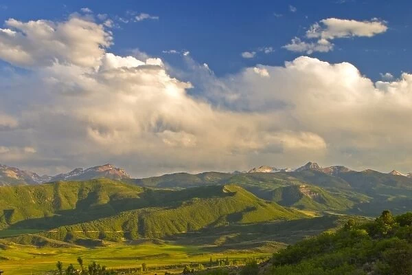 USA, Colorado, Aspen, Old Snowmass Valley. Summer sunset on green mountain vista