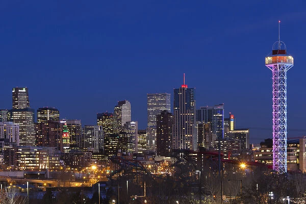 USA, Colorado, Denver, city view from the west at dusk with Elitch Gardens theme