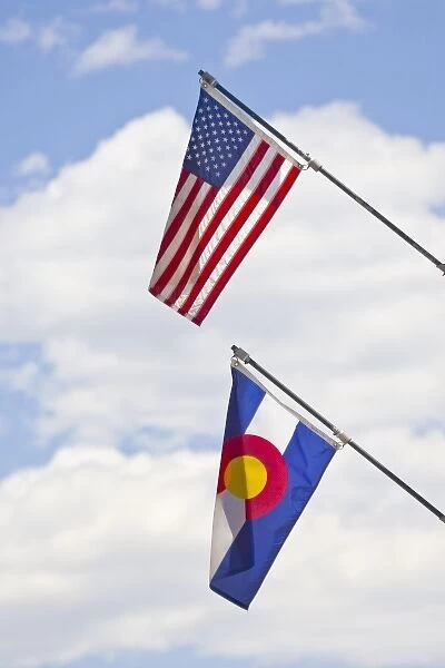 USA, Colorado, Frisco. American and Colorado state flags fly in July Fourth paradeFred J