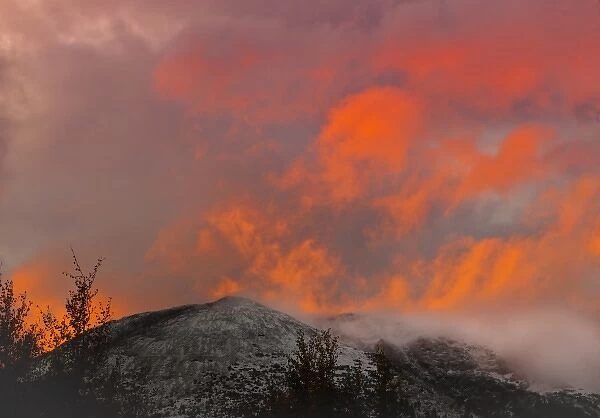 USA, Colorado, Frisco. Sunset illumines clouds over Buffalo Mountain