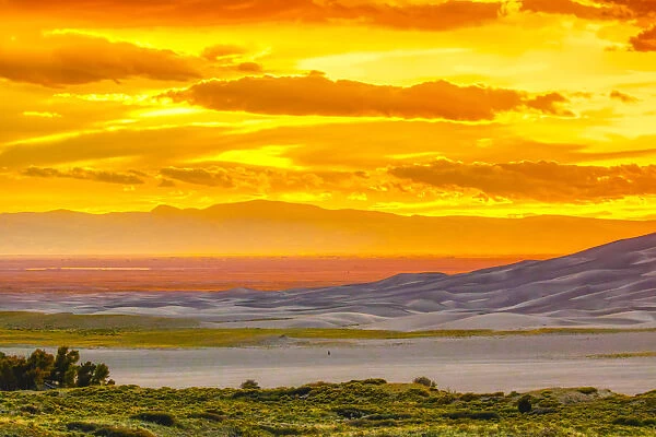 USA, Colorado, Great Sand Dunes National Park and Preserve. Sunset over dunes. Credit as