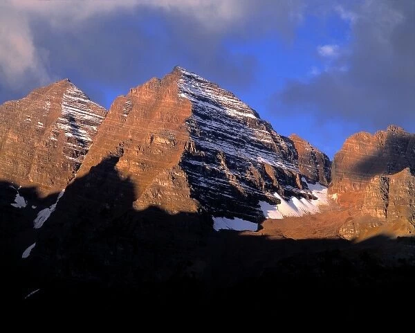 USA, Colorado, Maroon Bells. Both the early light and striations of snow enhance Maroon Bells