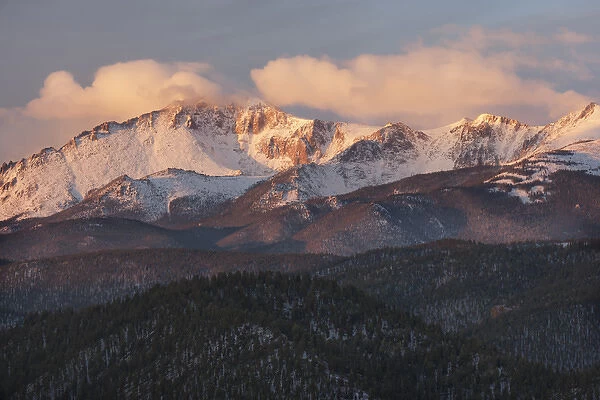 USA, Colorado, Pike National Forest. Clouds over Pikes Peak at sunrise. Credit as