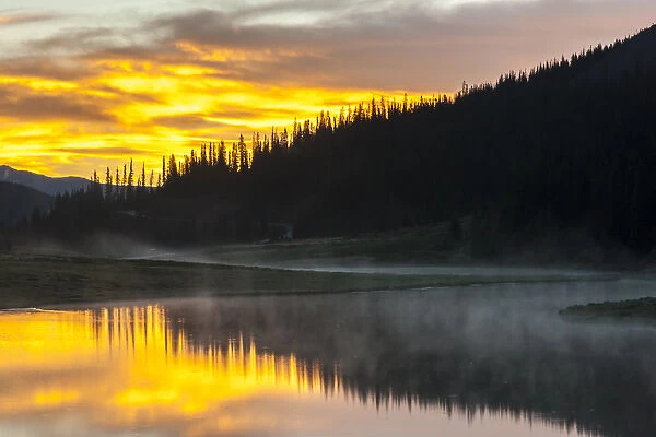 USA, Colorado, Rocky Mountain National Park. Foggy sunrise on Poudre Lake. Credit as