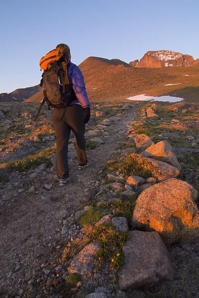 USA, Colorado, Rocky Mountain NP. A female hiker on the path to Longs Peak. (MR)