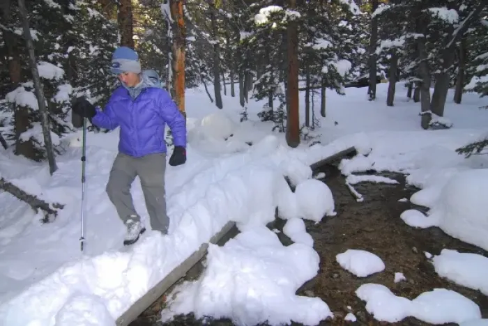 Framed Print : USA, Colorado, Rocky Mountain NP. A female hiker on a footpath covered by snow. (MR)