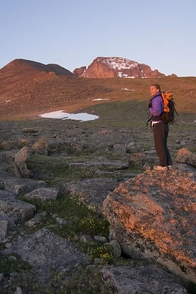 USA, Colorado, Rocky Mountain NP. A female hiker and Longs Peak. (MR)