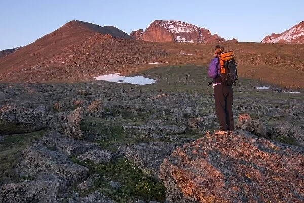 USA, Colorado, Rocky Mountain NP. A female hiker and Longs Peak. (MR)