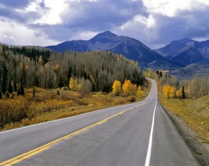 Framed Print : USA, Colorado, San Juan Mountains. A Colorado mountain highway in autumn beckons the driver farther