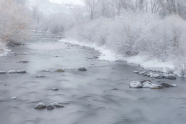 USA, Colorado, Steamboat Springs. Mist over river in winter
