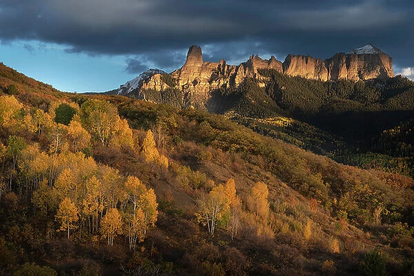 USA, Colorado, Uncompahgre National Forest. Sunset on aspens and rock formations