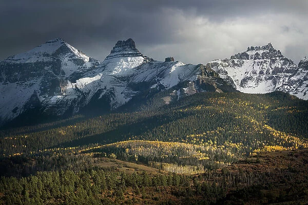 USA, Colorado, Uncompahgre National Forest. Mt Sneffels with storm and forest in autumn