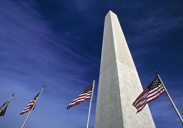 USA, District of Columbia. American flags fly at the base of the Washington Monument