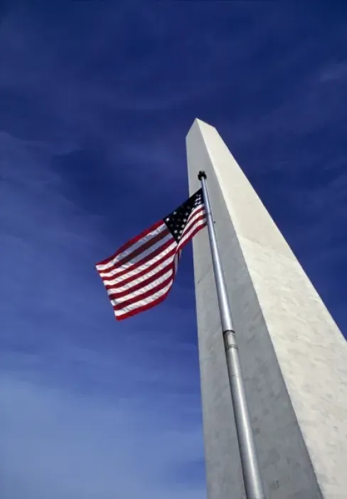 Framed Print : USA, District of Columbia. Against a deep blue sky, an American flag waves before Framed Print : USA, District of Columbia. Against a deep blue sky, an American flag waves before