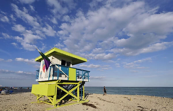 USA, Florida, Miami, South Beach. Man walks by lifeguard station on South Beach
