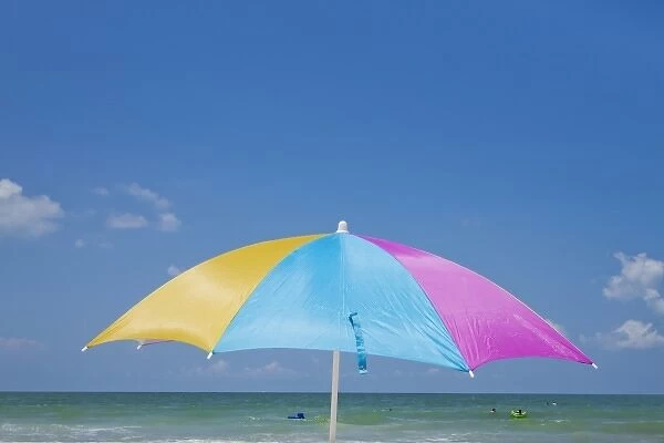 USA, Florida, St. Petersburgful beach umbrella along Gulf of Mexico on summer morning
