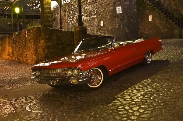 USA; Georgia; Savannah; An antique red Cadillac convertible parked in the Historic District