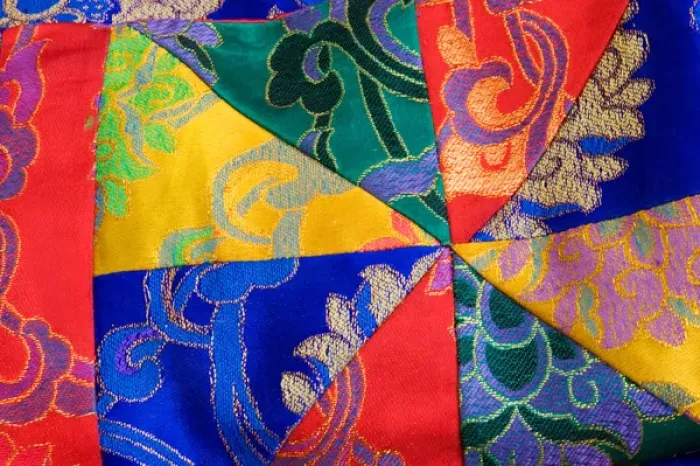 Framed Print : USA; Georgia; Savannah; Fabric from Nepal on display