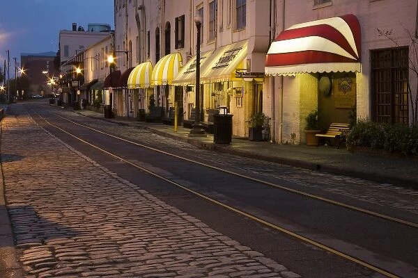 USA, Georgia, Savannah. Scenic view of the cobblestone River Street at night in the