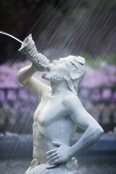 USA; Georgia; Savannah. Staue of a Triton at the fountain in Forsyth Park