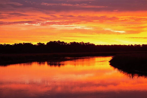 USA, Georgia, Savannah. Sunrise along Grimball Creek