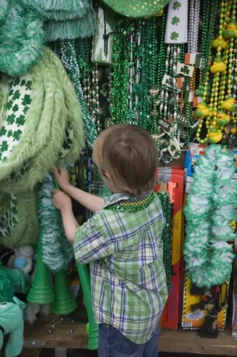 Framed Print : USA; Georgia Savannah. Young boy looking for a St. Patricks Day souvenir. (MR) Framed Print : USA; Georgia Savannah. Young boy looking for a St. Patricks Day souvenir. (MR)