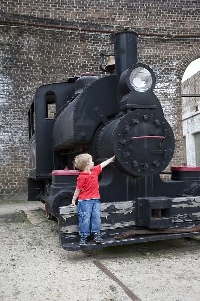 USA; Georgia; Savannah. Young boy at Roundhouse Train Museum. (MR)