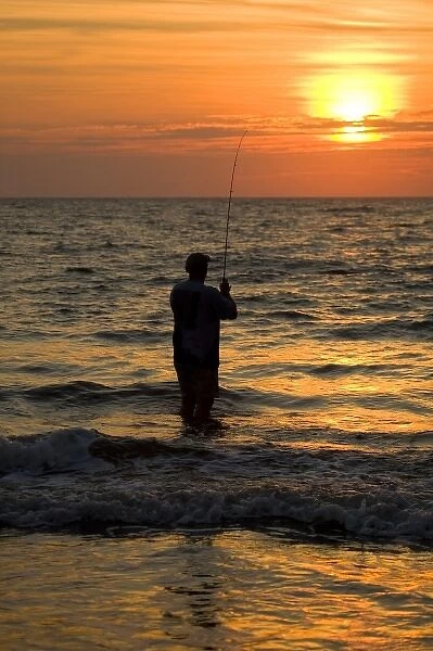 USA, Georgia, Tybee Island, Fisherman at sunrise (MR)