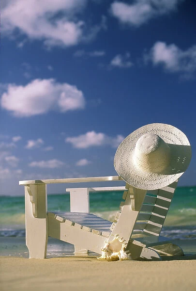 USA, Hawaii. Chair and sun hat on beach