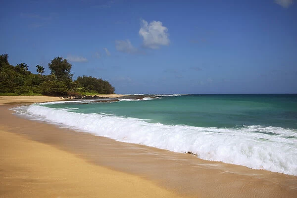 USA, Hawaii, Kauai. Wave breaks on deserted beach