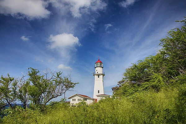 USA; Hawaii; Oahu; Morning light on Diamond Head Lighthouse with Puffy Clouds