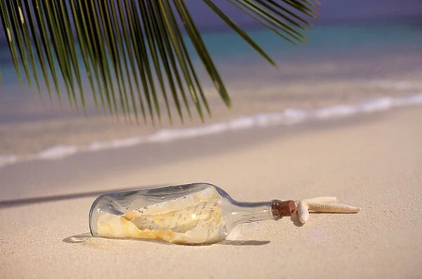 USA, Hawaiian Islands. Message in a bottle on the sands of a tropical beach