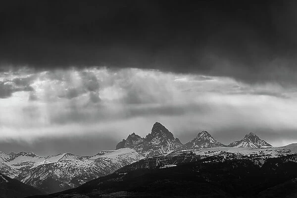 USA, Idaho. Black and White landscape of Virga clouds and view of Teton Mountains from the west