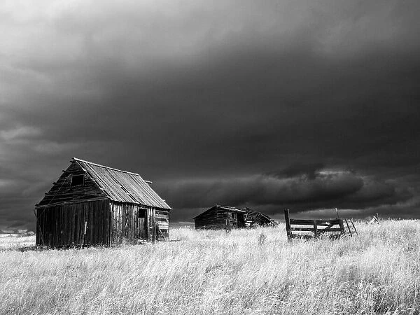 USA, Idaho, Highway 36, Liberty storm passing over old wooden barn