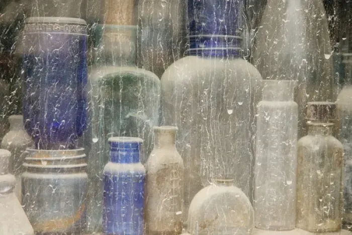 Framed Print : USA, Idaho, Idaho City. Close-up of dusty bottles in window