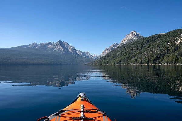 USA, Idaho, Redfish Lake. Kayak facing Sawtooth Mountains